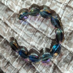 Multi-colored Faceted Oval Glass Beads.